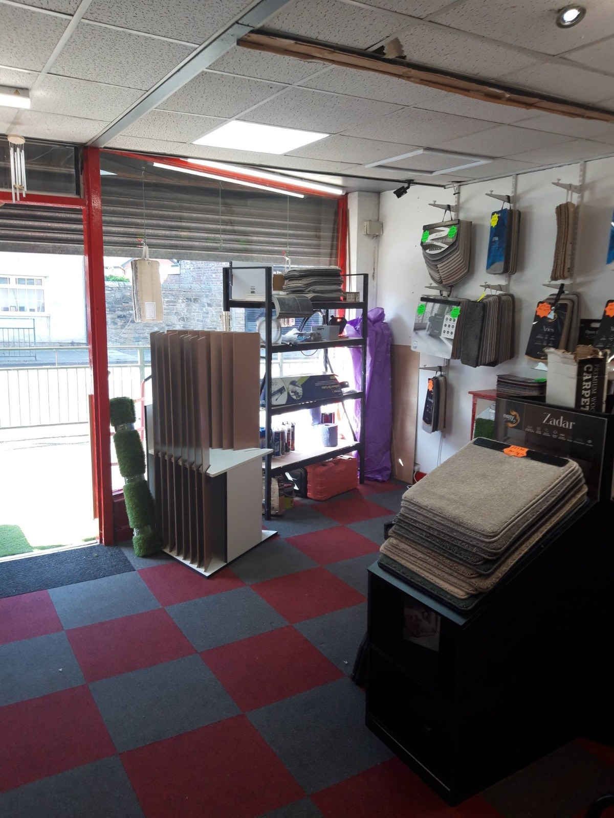 Inside the showroom — tools, displays and signature red & grey tiles