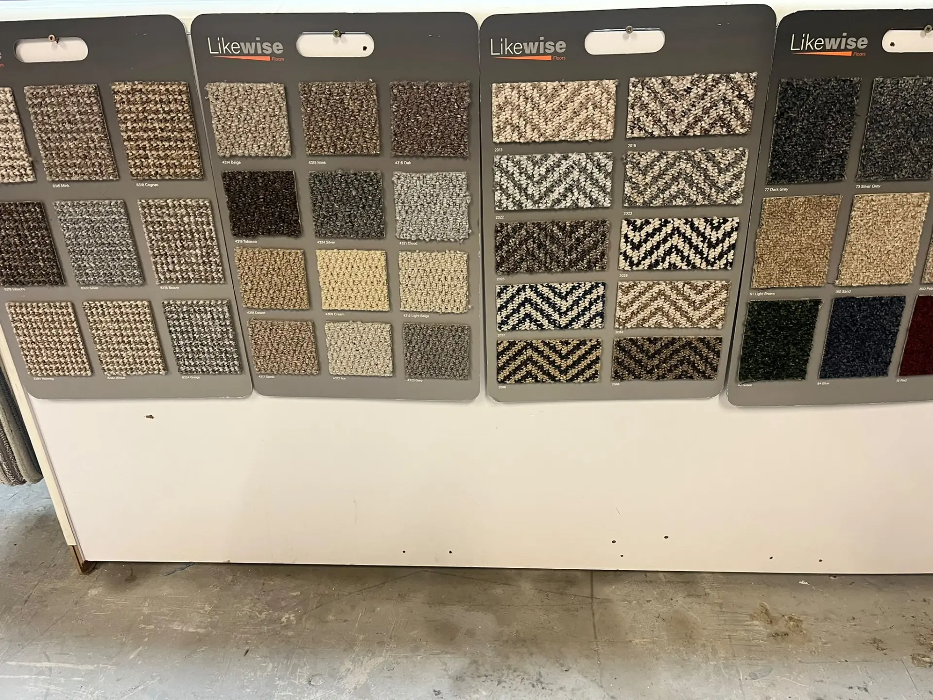 Plain, textured and patterned carpet samples to compare
